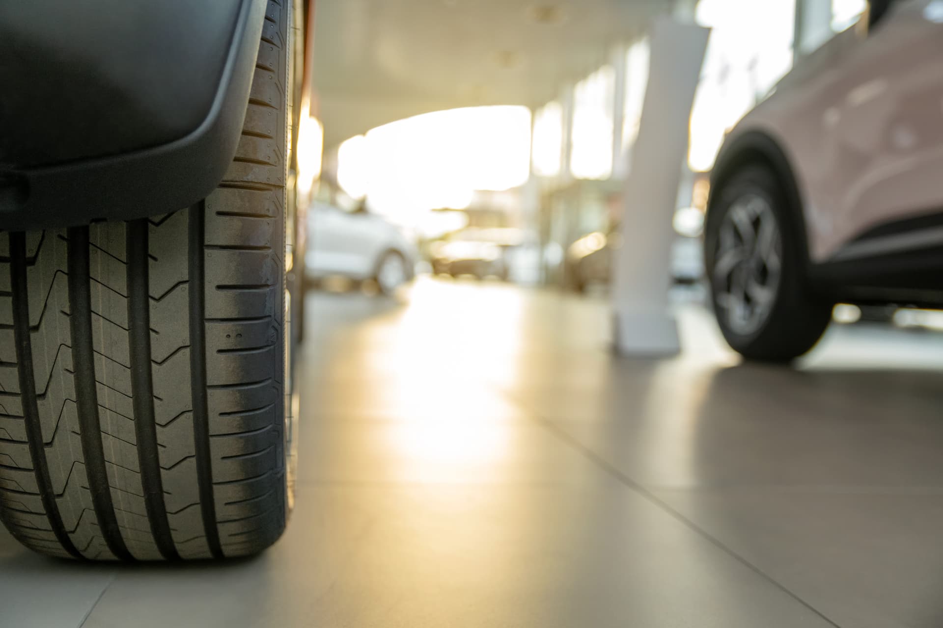 A close-up of a vehicle wheel in a dealership