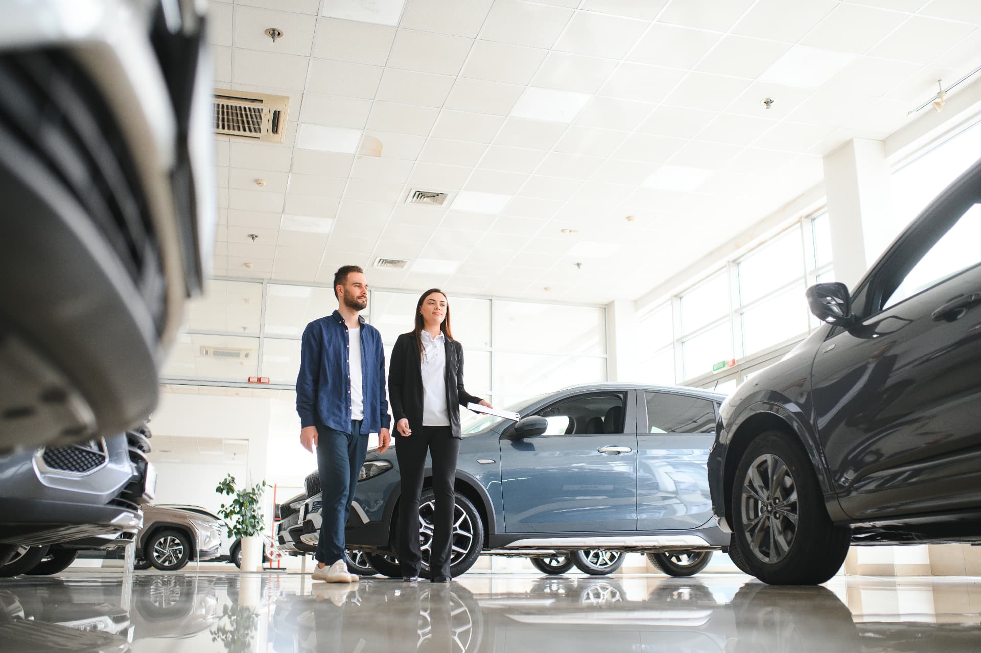 Customers discussing a vehicle purchase at a dealership