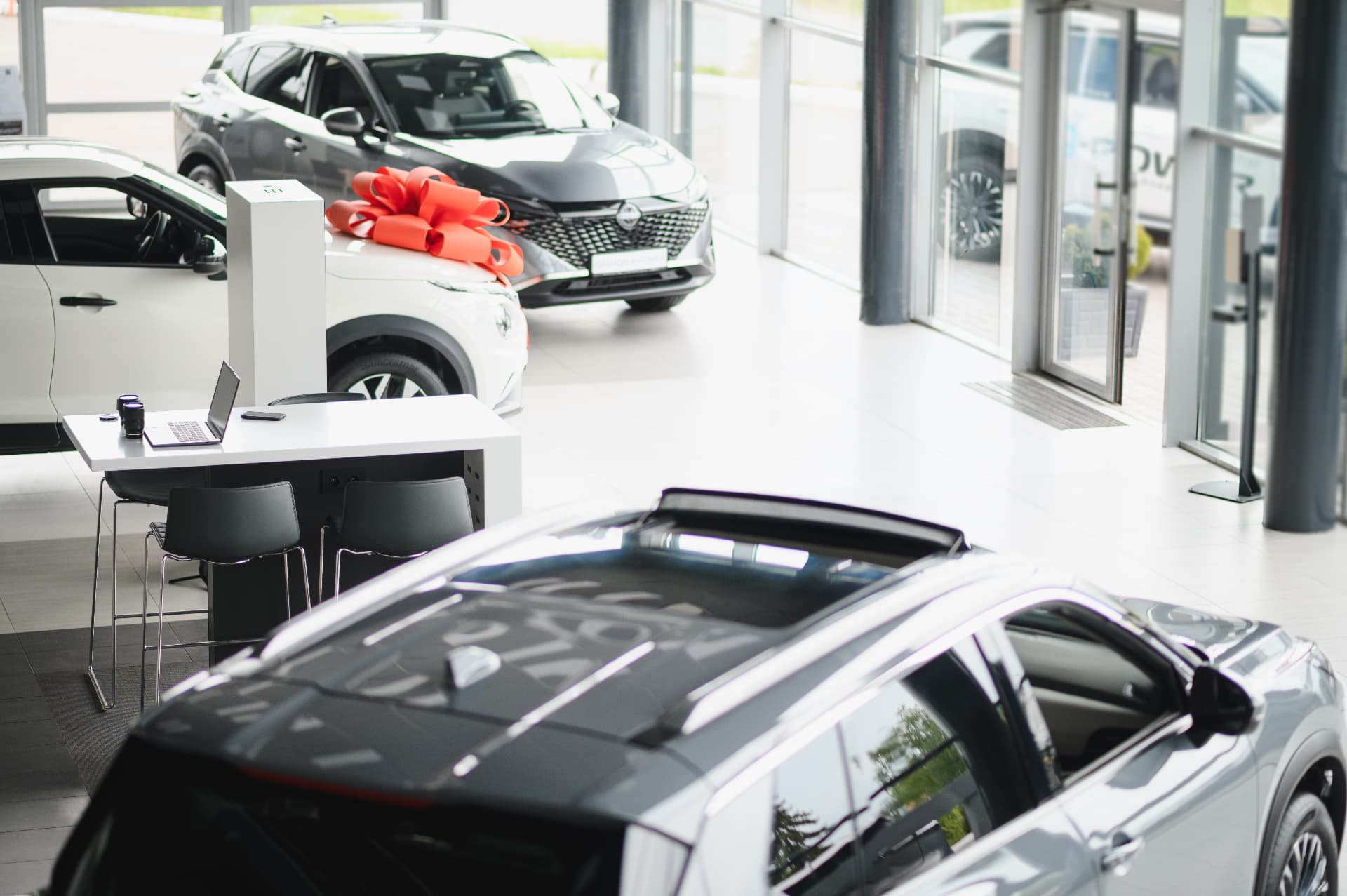 A couple walking through a dealership showroom
